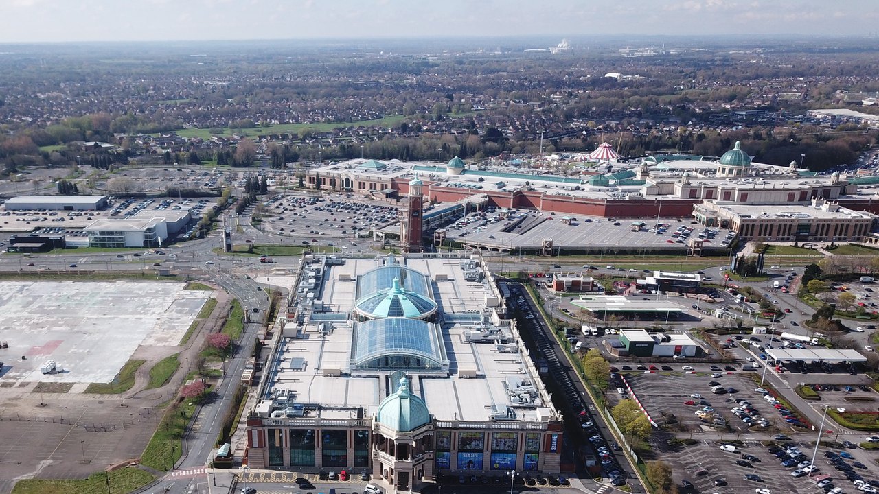 Aerial of Barton Square in the foreground and the Trafford Centre beyond.