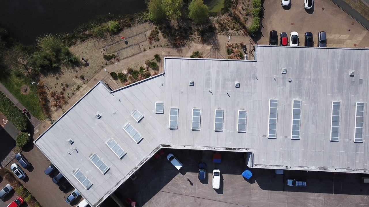 Overhead of an L-plan trade-centre unit, loading court and parking.
